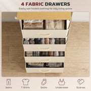 Four drawers open displaying folded jeans, t-shirts and scarves from above, shown in beige