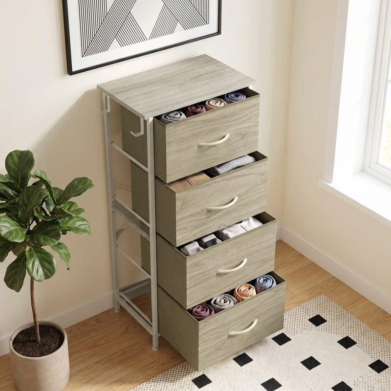 Chest of drawers in a bright room with rolled clothes in the open drawers, shown in oak