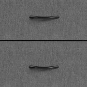 Close-up of the black drawer handles on the grey fabric
