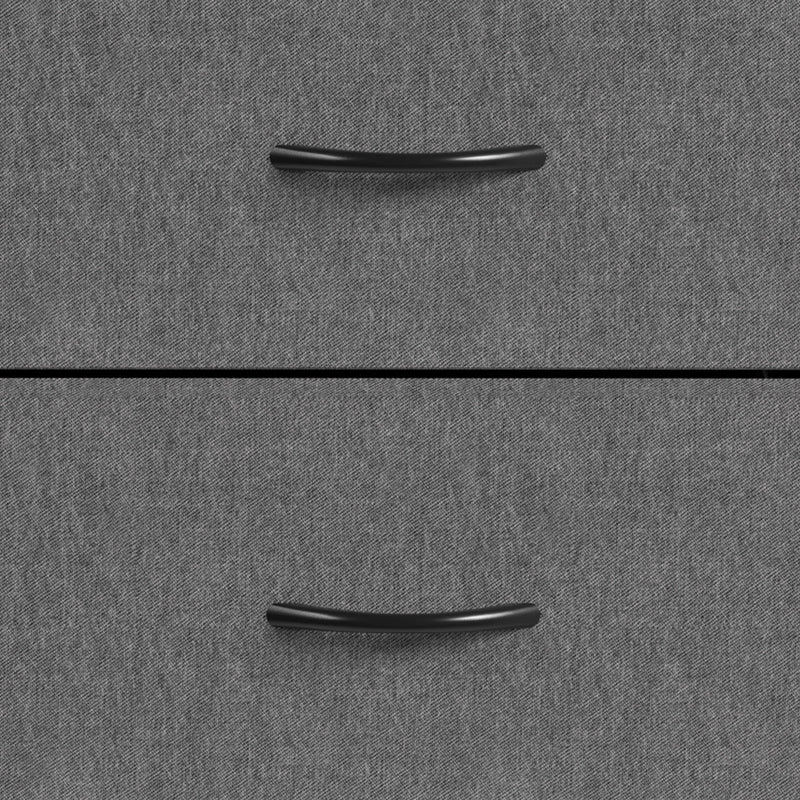 Close-up of the black drawer handles on the grey fabric