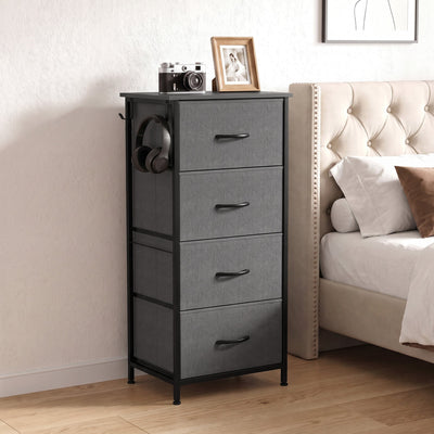 Grey fabric chest of drawers beside a bed in a bedroom