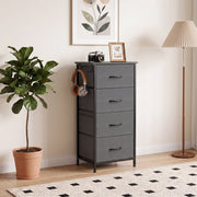 Grey chest of drawers in a bedroom with headphones hanging on the side hook