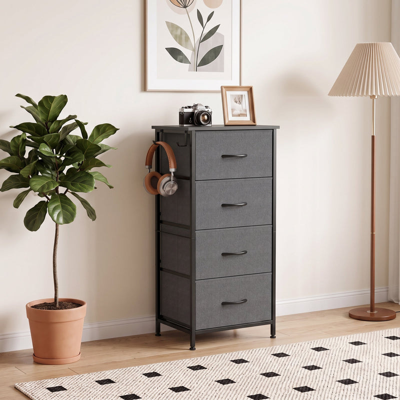 Grey chest of drawers in a bedroom with headphones hanging on the side hook