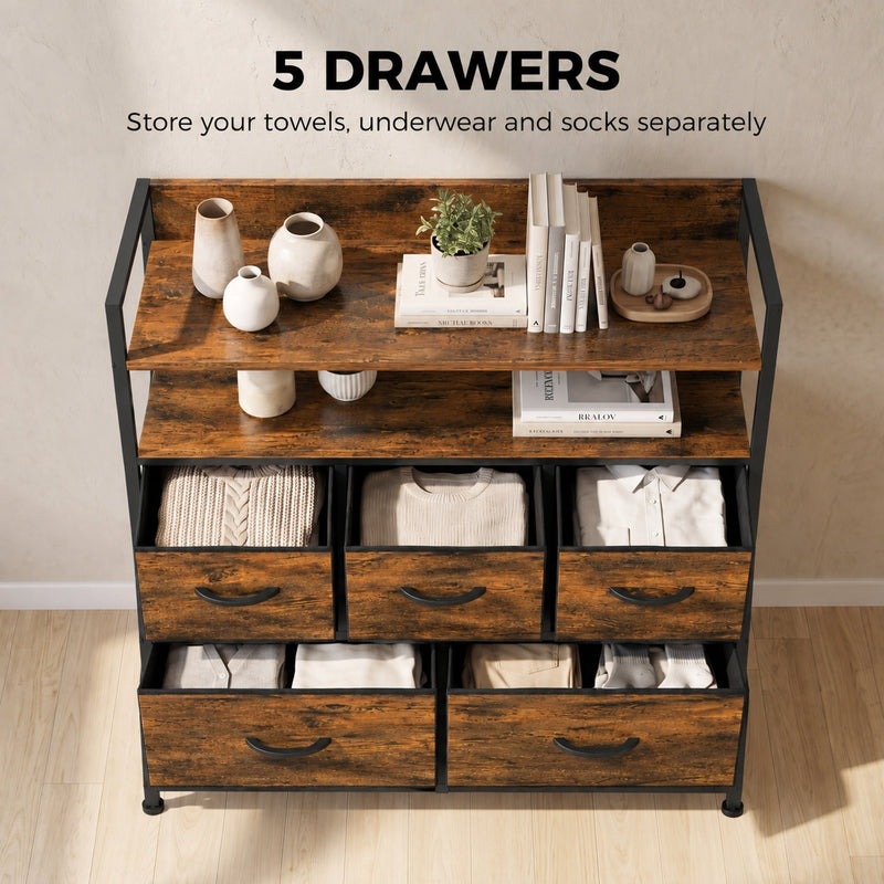 Chest of drawers with towels, underwear and socks stored in the five fabric drawers and vases on the shelves