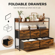 Chest of drawers with folded towels on the shelves and an inset showing a fabric drawer folded flat