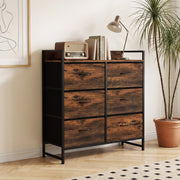 Six-drawer chest of drawers in a bedroom corner with lamp, radio and books on top