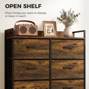 Close-up of the open top shelf displaying a radio, photo frame and vase