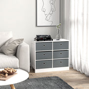 Fabric chest of drawers in a living room beside a sofa with books and a vase on top