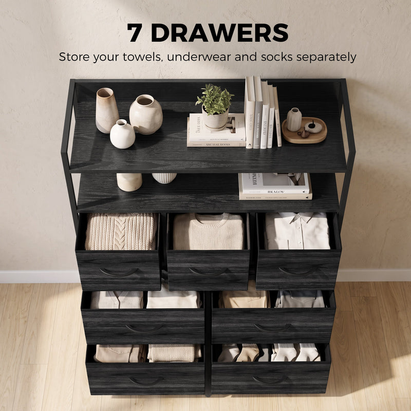 Black chest of drawers with towels, underwear and socks neatly stored in the seven fabric drawers