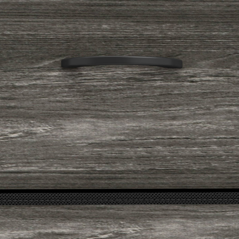 Close-up of the grey wood-effect drawer front and recessed handle