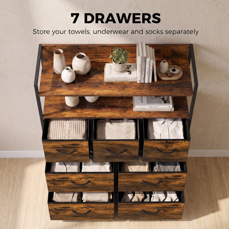 Rustic brown chest of drawers with towels, underwear and socks neatly stored in the seven fabric drawers