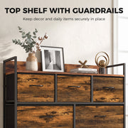 Top shelf with raised guardrails holding a plant, framed print and ornaments