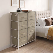 Wood grain drawers in a bedroom, with a camera and books on top