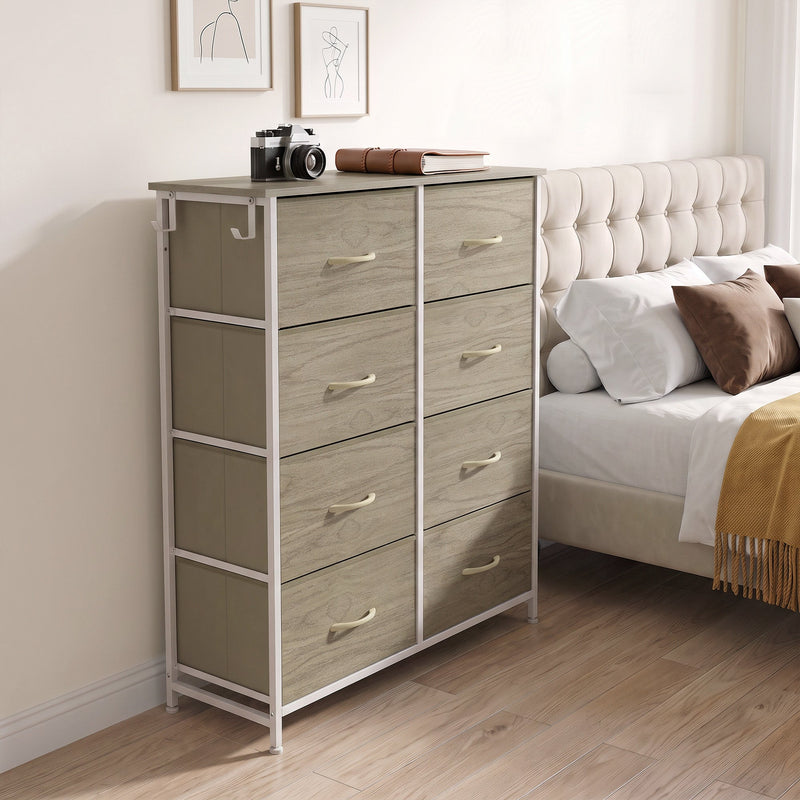 Wood grain drawers in a bedroom, with a camera and books on top