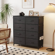Black 8 drawer fabric chest of drawers, front view in a room