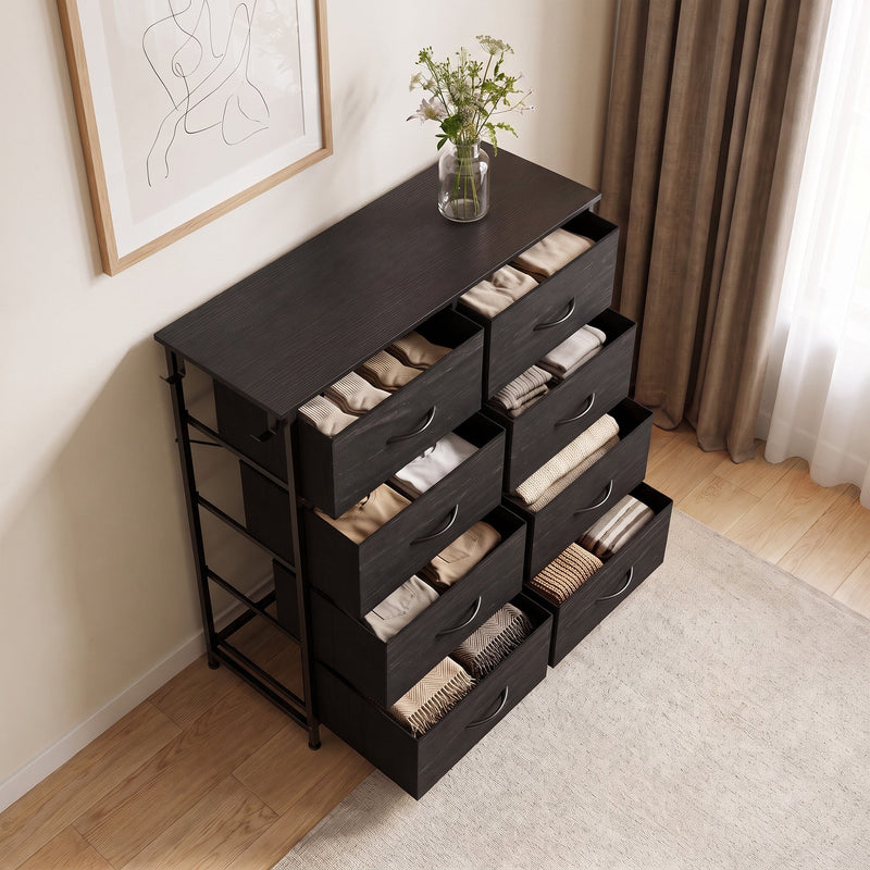 Black 8 drawer fabric chest of drawers styled in a living room