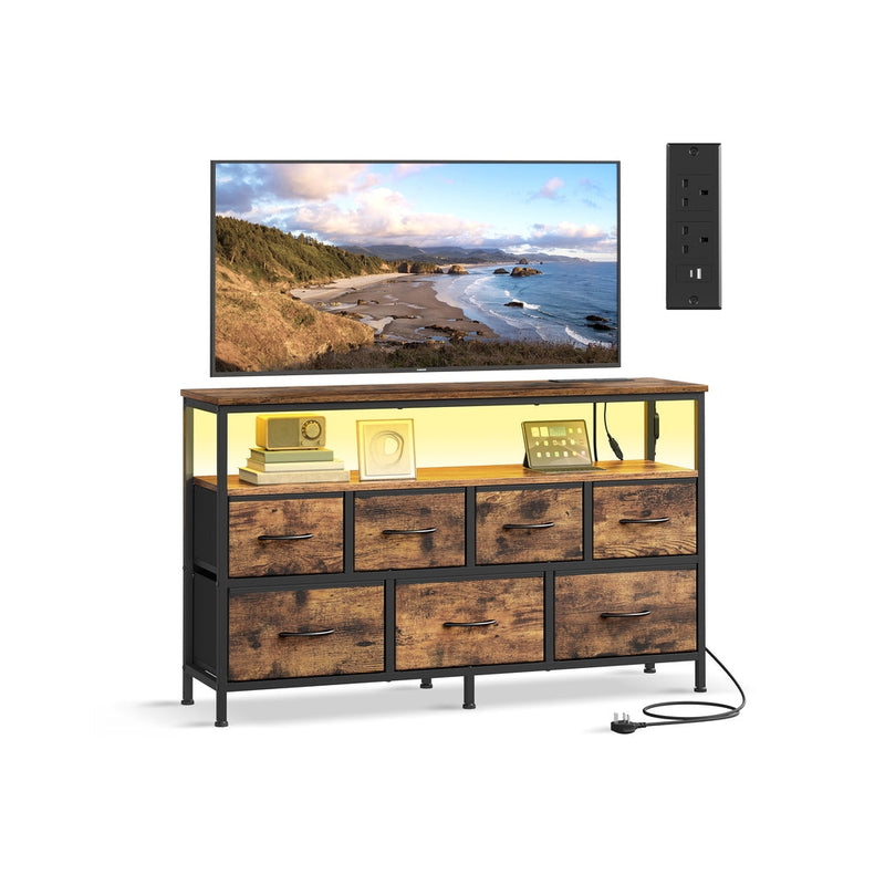 Songmics chest of drawers with charging station in rustic brown, styled as a TV console with a wall socket beside it