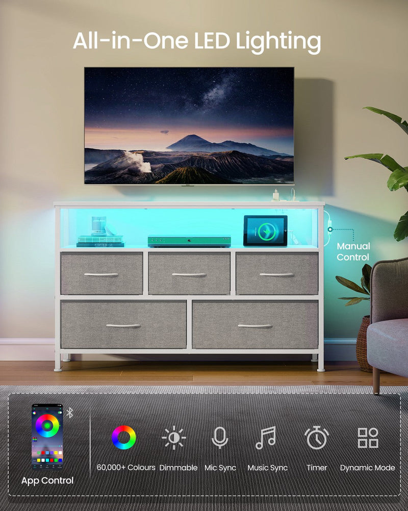 Chest of drawers used as a TV console with cyan LED strip lighting glowing under the open top shelf, illustrating the app-controlled lighting feature.