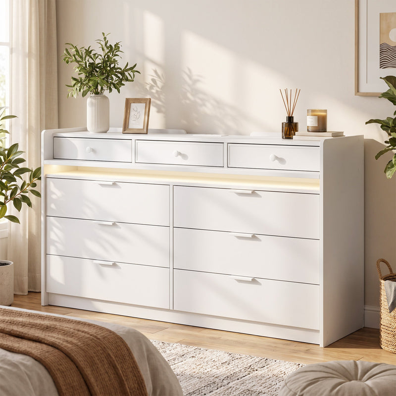 White chest of drawers with warm LED strip in a bright bedroom