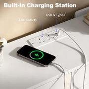 Built-in charging station on a white top with 2 UK outlets, USB and Type-C ports