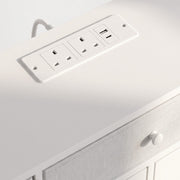 Close-up of the two UK outlets and USB ports in the white top panel