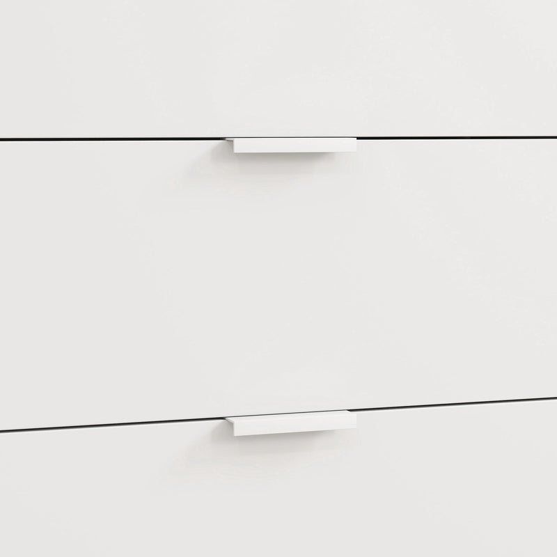 Close-up of two white drawer fronts with slim recessed handles