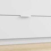 Close-up of a white drawer front with a slim handle above the base