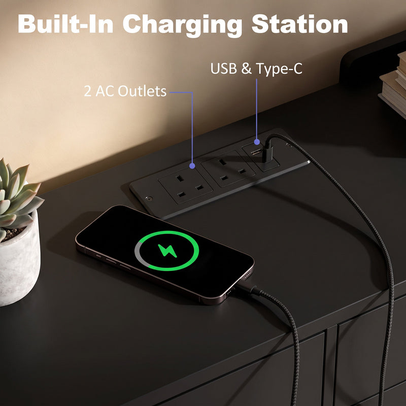 Built-in charging station on a black top with 2 UK outlets, USB and Type-C ports