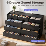 Black chest of drawers showing 3 small drawers and 6 large drawers filled with clothes