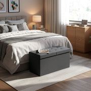 Dark grey Chesterfield ottoman bench shown in a hallway setting