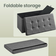 Dark grey Chesterfield ottoman bench, angled corner view