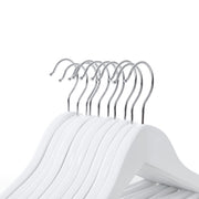 Close-up of the chrome hooks on a row of white children's hangers