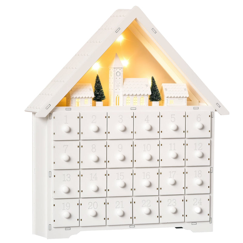 White wooden house advent calendar with 24 drawers and a lit village scene on a white background