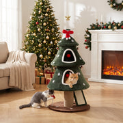 Christmas tree cat tower with one cat in the lower condo and another playing at the base