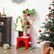 Christmas cat tree with a cat in a Santa hat on the platform beside a Christmas tree