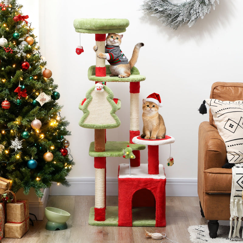 Christmas cat tree with two cats beside a Christmas tree and presents