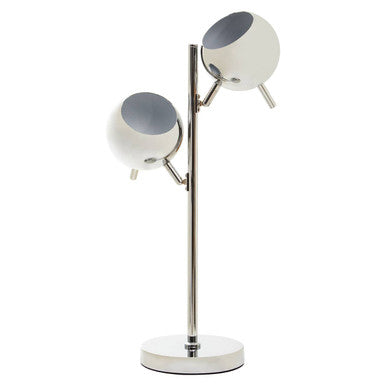 Chrome table lamp with two round shades on a plain background