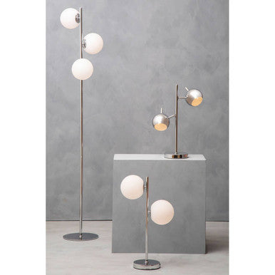 Chrome two light table lamp on a bedside table