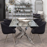 Chrome rectangular glass dining table styled in a modern dining room
