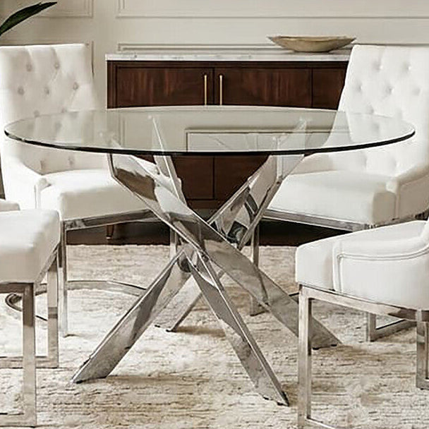 Chrome round glass dining table styled in a modern dining room