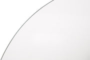 Close-up of the silver metal base detail on the round glass dining table