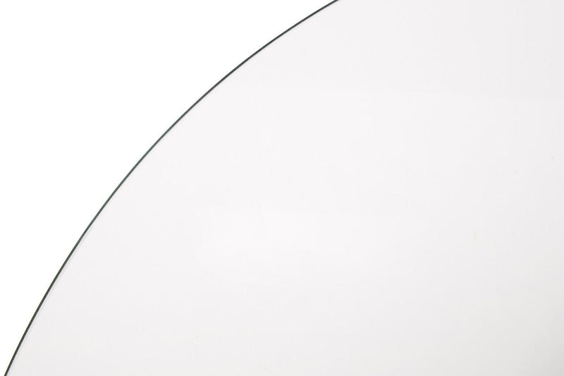 Close-up of the silver metal base detail on the round glass dining table