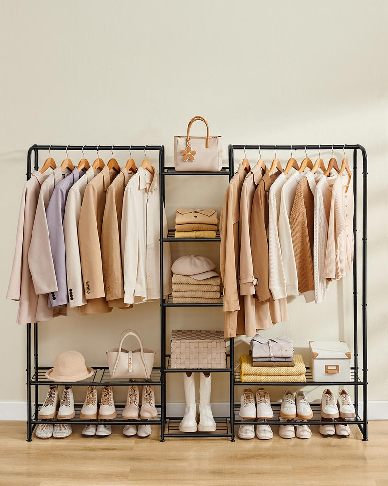 Open wardrobe hanging rail with clothes styled in bedroom