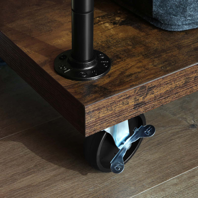 Close-up of a braked castor fitted under the rustic brown base board