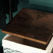 Close-up of a rustic brown shelf board above a woven basket