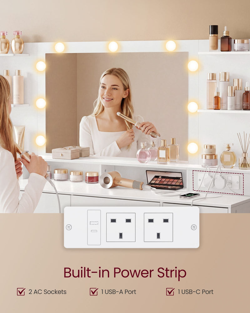 Woman styling her hair at the lit mirror, with the built-in power strip showing 2 AC sockets, USB-A and USB-C ports