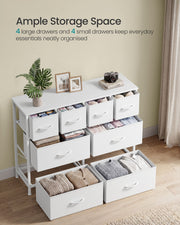 White 8 drawer chest with every drawer open and filled with folded clothes