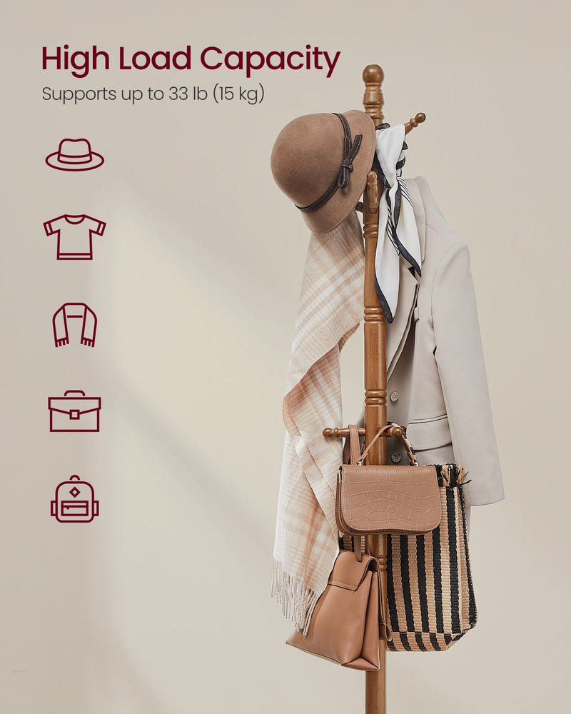 The coat tree loaded with a hat, scarf, jacket and two bags to show its 15 kg capacity