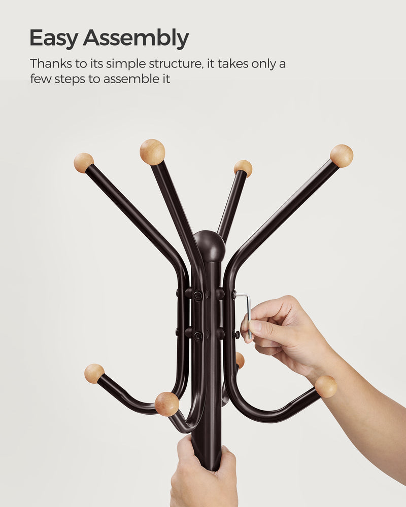Assembly step showing hooks being fitted to the coat stand pole
