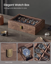 Coffee brown watch box closed on a desk showing the metal clasp and stitched leather